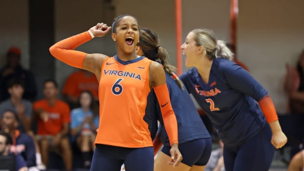 Milan Gomillion reacts during the Virginia volleyball match against Wofford at Memorial Gymnasium.